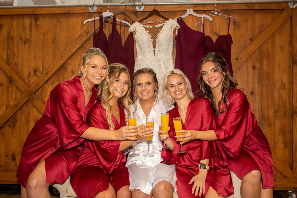 Bride and Bridesmaids toasting with mimosas