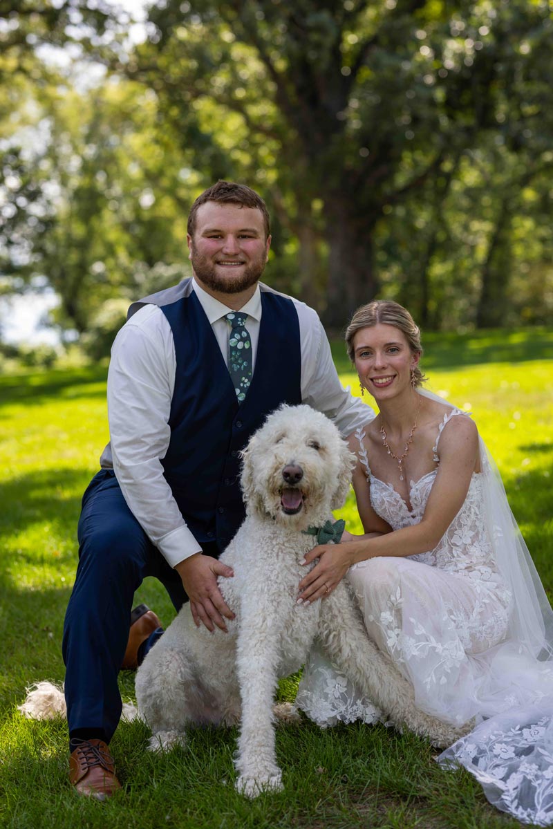 Bride Groom and their dog posing for wedding
