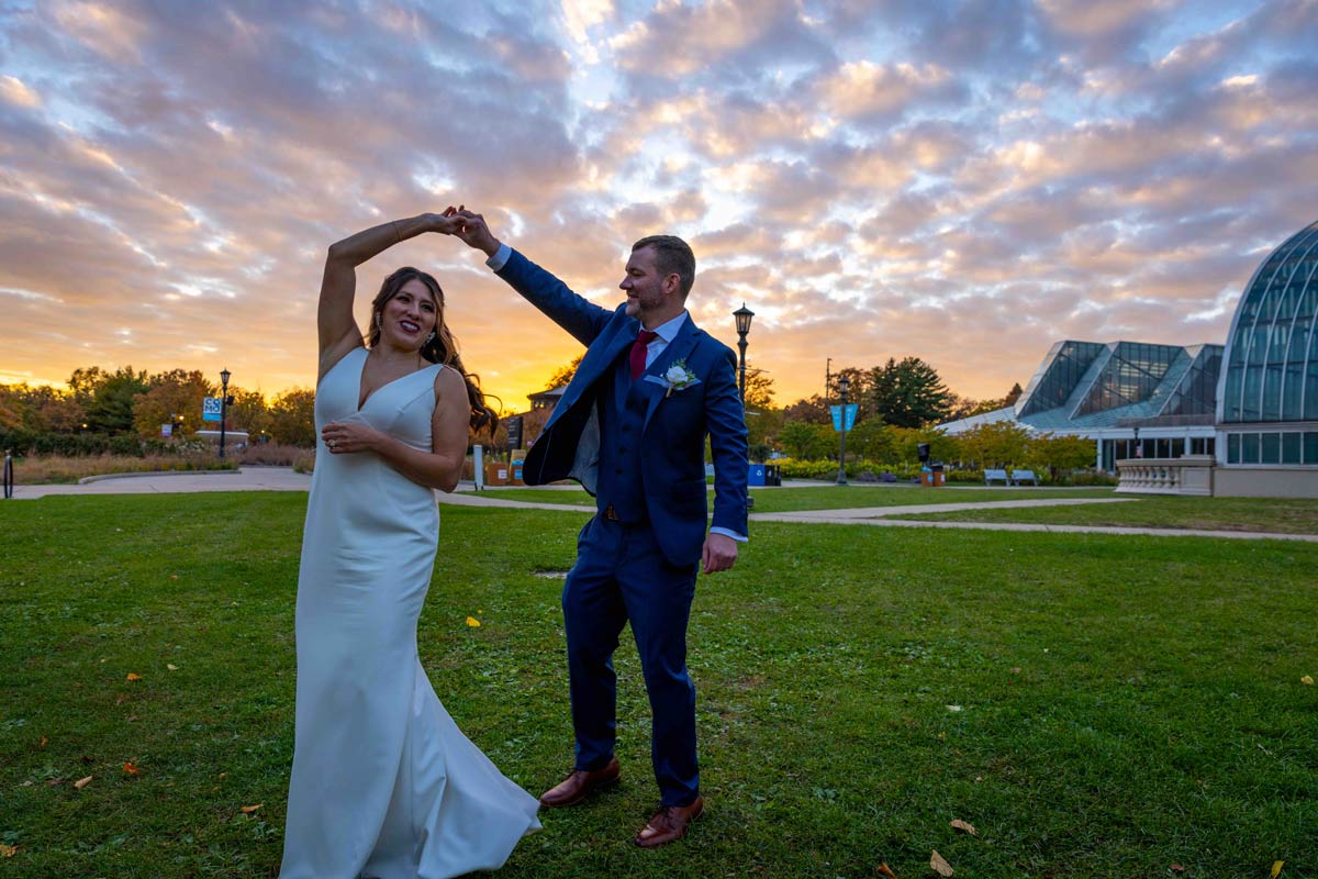 Sunset over Como Park Minnesota with a dancing bride and groom